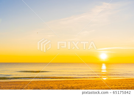 Beautiful tropical nature beach sea ocean at sunset or sunrise Beautiful tropical nature beach sea ocean at sunset or sunrise 65175842