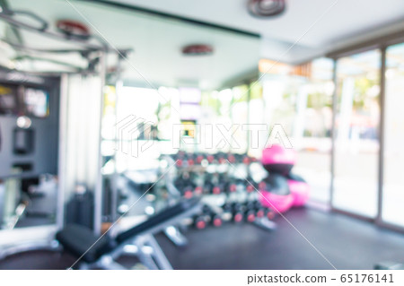 Abstract blur gym room interior with fitness equipment Abstract blur gym room interior with fitness equipment 65176141
