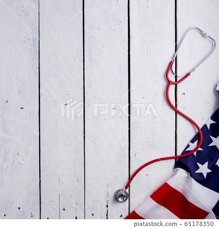 American Flag With Stethoscope On Table American Flag With Stethoscope On Table 65178350