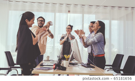 Successful business people celebrating success. 65181656