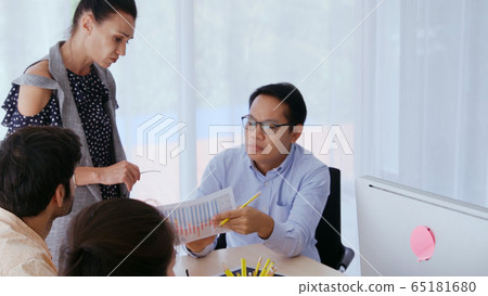Unhappy business people in group meeting. Unhappy business people in group meeting. 65181680