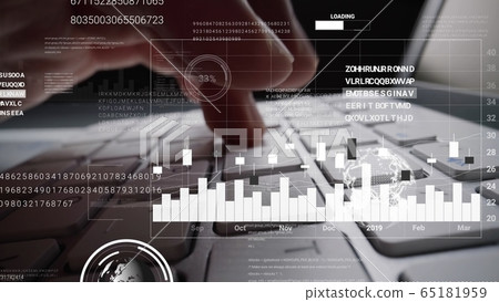Man working on laptop computer keyboard with 65181959