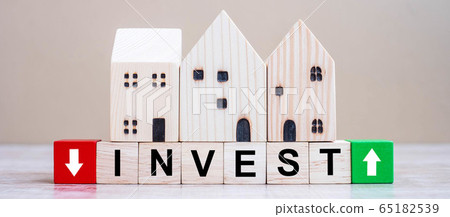 INVEST cube blocks with wooden house model on INVEST cube blocks with wooden house model on 65182539