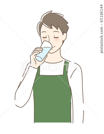 A man drinking water in a glass A man drinking water in a glass 65186144