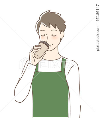 A man drinking a take-out coffee 65186147