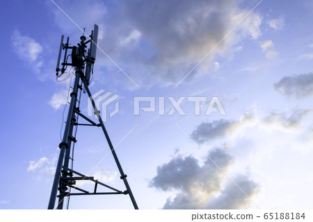 Silhouette of telecommunication tower of 4G and 5G cellular, mobile and internet station tower in cloudy sky background. Silhouette of telecommunication tower of 4G and 5G cellular, mobile and internet station tower in cloudy sky background. 65188184