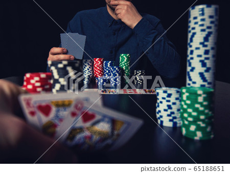 Close up of two men poker players looking cautious Close up of two men poker players looking cautious 65188651