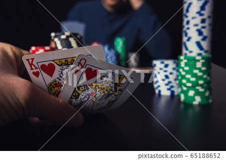 Close up of young man poker player looking 65188652