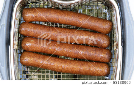 Frikadellen, a Dutch fast food snack in the oil 65188963