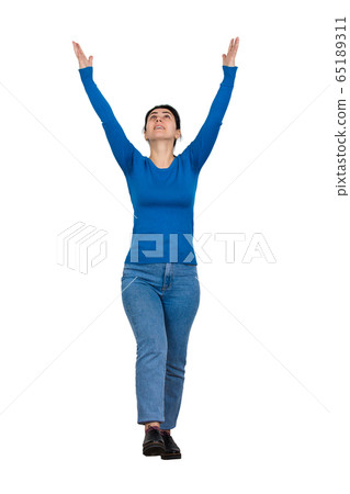 Full length portrait of thankful young woman Full length portrait of thankful young woman 65189311