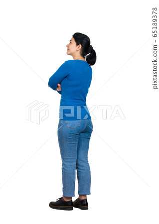 Full length side view of casual, confident young Full length side view of casual, confident young 65189378