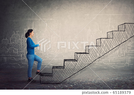 Motivated and confident young woman hurry to climb Motivated and confident young woman hurry to climb 65189379
