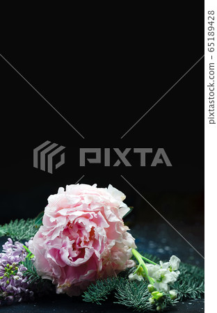 Beautiful bouquet flowers from peonies, lilacs and hydrangeas decorated with coniferous branches. 65189428