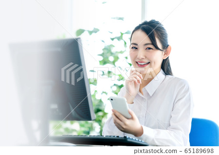 Office female smartphone computer desk work Office female smartphone computer desk work 65189698