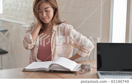Close up shot of a university girl reading a final Close up shot of a university girl reading a final 65190749