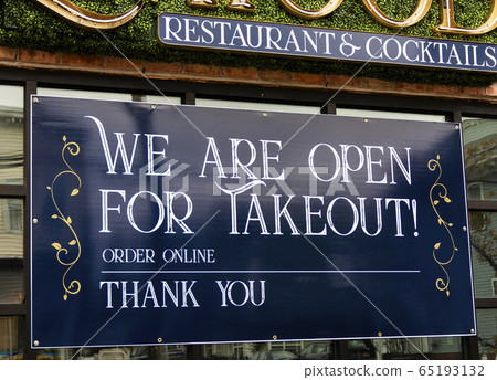We are open sign on window of restaurant for 65193132