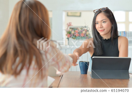 A portrait of a young businesswoman handshake A portrait of a young businesswoman handshake 65194070