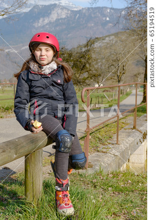 preteen with roller skate helmet, eat an apple preteen with roller skate helmet, eat an apple 65194519
