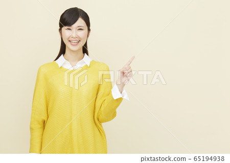 Woman beige background 65194938