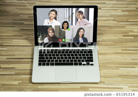 Asian business people team talking to her colleagues in company video conference. Group of business women using laptop for online meeting with video call while working from home 65195314