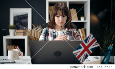 Teenage girl studying at computer Teenage girl studying at computer 65196642
