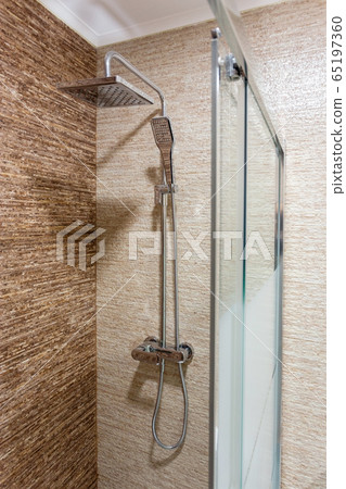Modern bathroom with shower, glass door. Close-up. Modern bathroom with shower, glass door. Close-up. 65197360