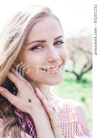 Ladybird on a hand nice Blondes spring Ladybird on a hand nice Blondes spring 65201232