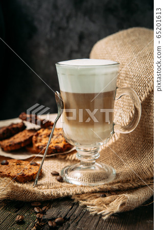 Latte Macchiato with cookies on the wooden table 65201613