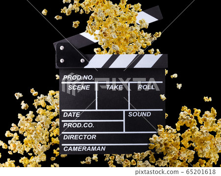 Flying popcorn and film clapper board isolated on black background Flying popcorn and film clapper board isolated on black background 65201618