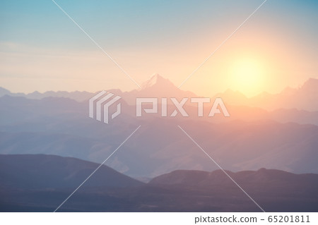 Blurred of Peak on mountain range with sunrise at Blurred of Peak on mountain range with sunrise at 65201811