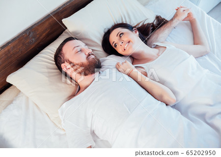 a man with a woman in the morning woke up in a bedroom dream 65202950