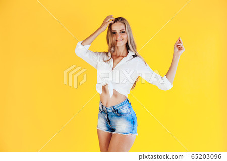 blonde girl with blue eyes posing portrait shorts blonde girl with blue eyes posing portrait shorts 65203096