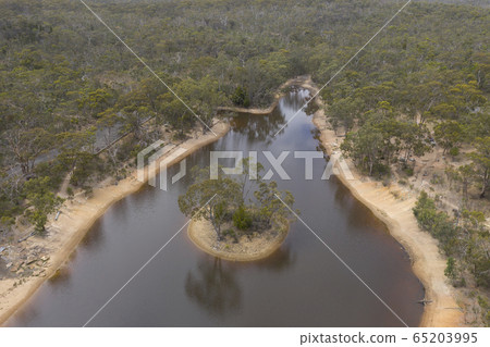 Aerial view of a drought affected water reservoir and small island in rural Australia Aerial view of a drought affected water reservoir and small island in rural Australia 65203995