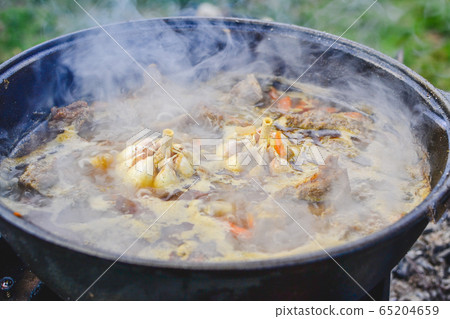 Pilaf on the cooking stage, zirvak with garlic, Pilaf on the cooking stage, zirvak with garlic, 65204659