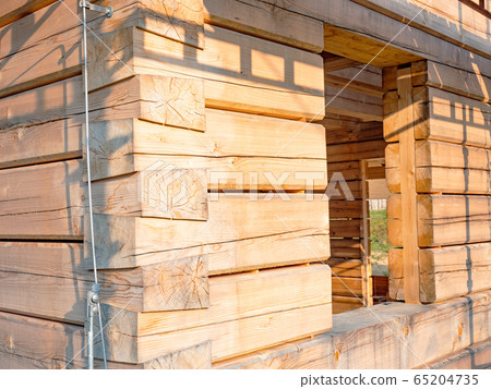 Steel wire of lightning conductor on wooden wall. Steel wire of lightning conductor on wooden wall. 65204735