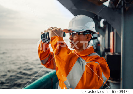 Filipino deck Officer on deck of vessel or ship , wearing PPE personal protective equipment Filipino deck Officer on deck of vessel or ship , wearing PPE personal protective equipment 65209474