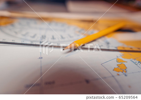 Filipino deck Officer on bridge of vessel or ship during navigaton watch at sea. 65209564