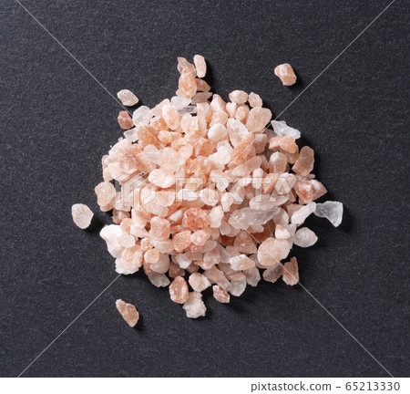 Pink rock salt with black background 65213330