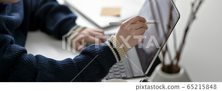 Cropped shot of female freelancer drawing on Cropped shot of female freelancer drawing on 65215848