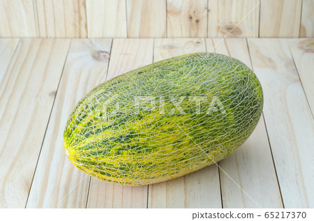 Tibet melon on wood background 65217370