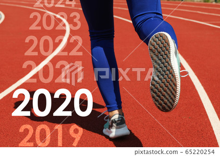 Girl running on red athletic track. Sport concept 65220254