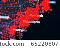 COVID-19 coronavirus pandemic on the US map in close-up with red dots of infection centers. COVID-19 coronavirus pandemic on the US map in close-up with red dots of infection centers. 65220807