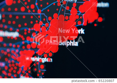 COVID-19 coronavirus pandemic on the US map in close-up with red dots of infection centers. COVID-19 coronavirus pandemic on the US map in close-up with red dots of infection centers. 65220807