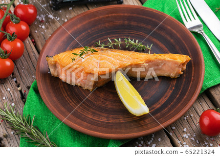 Plate with backed salmon steaks. Plate with backed salmon steaks. 65221324