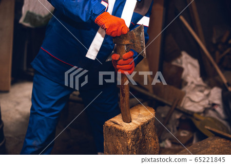 Close up of hands of repairman, professional builder working outdoors, repairing 65221845
