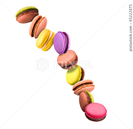 Set of flying french colorful macaroons isolated on white background 65222875