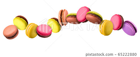 Set of flying french colorful macaroons isolated on white background 65222880