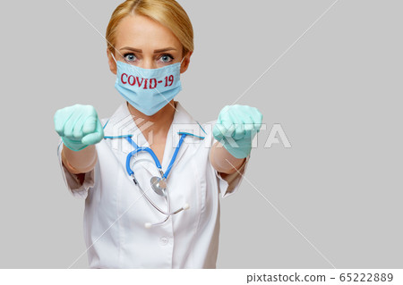 medical doctor nurse woman with stethoscope wearing protective mask medical doctor nurse woman with stethoscope wearing protective mask 65222889