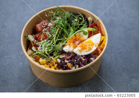 Traditional Hawaiian poke salmon dish in a cardboard box Traditional Hawaiian poke salmon dish in a cardboard box 65223005