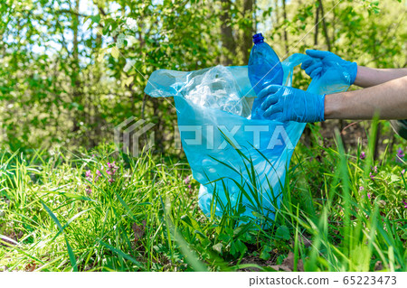 cleaning nature by collecting plastic waste, plastic bottles from the drink cause an ecological disaster cleaning nature by collecting plastic waste, plastic bottles from the drink cause an ecological disaster 65223473